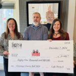 From left to right: Carly Barnes, Executive Director of Caring & Sharing of South Walton; David Kessler and Jackie Maliszewski, owners of Cafe Thirty-A.