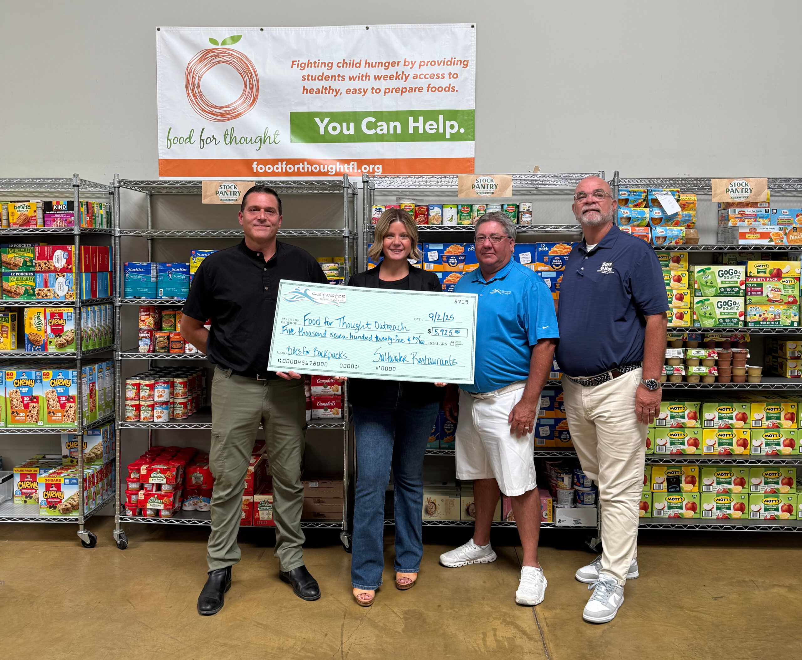 Saltwater Restaurants Presents Check to Food for Thought Outreach Following Bites for Backpacks Campaign